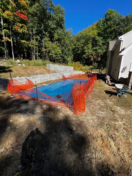 before: pool with torn up dirth around